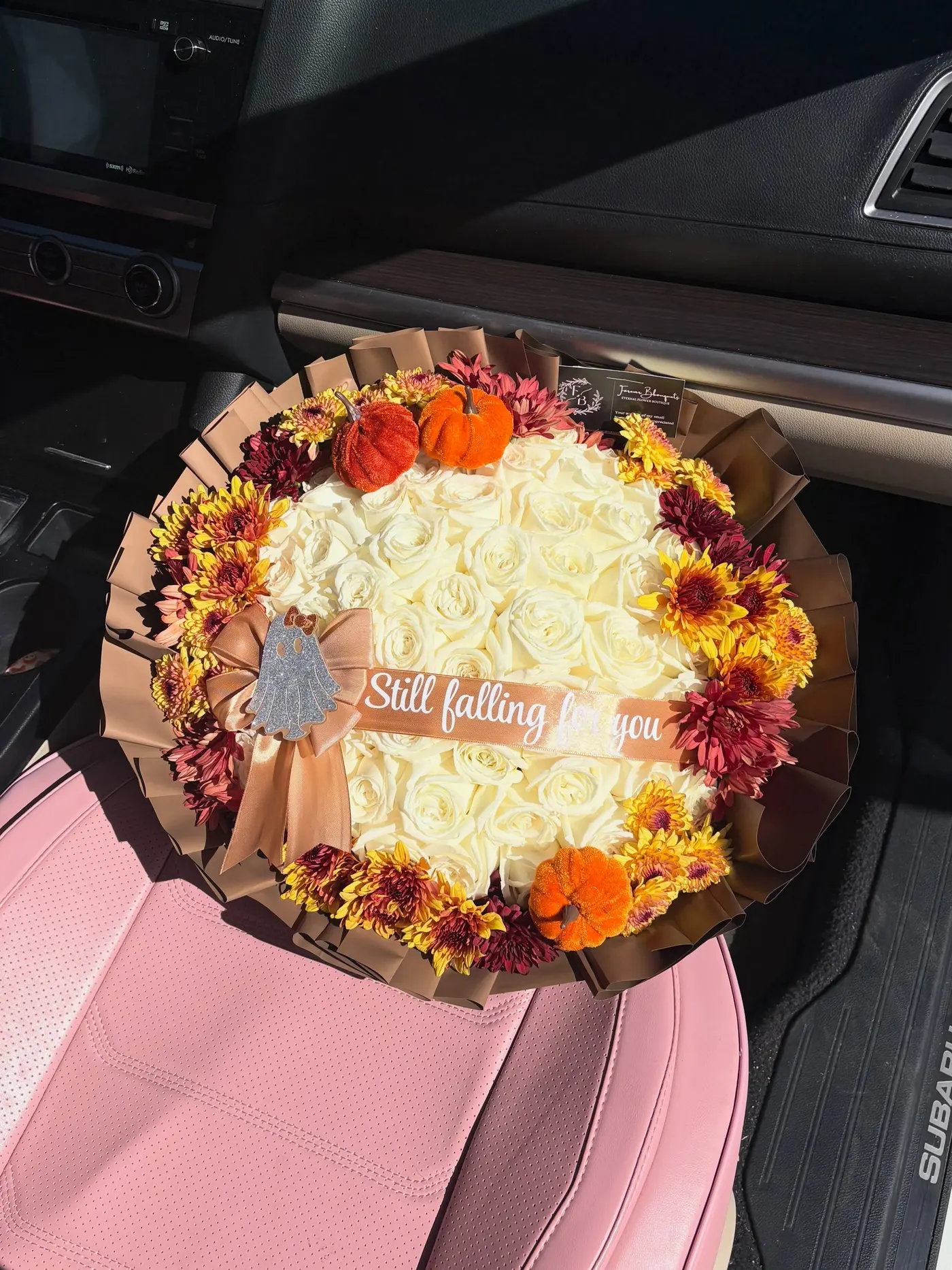 Fall bouquet of cream roses and mums with a 'Still falling for you' ribbon, by Forever Blouquets